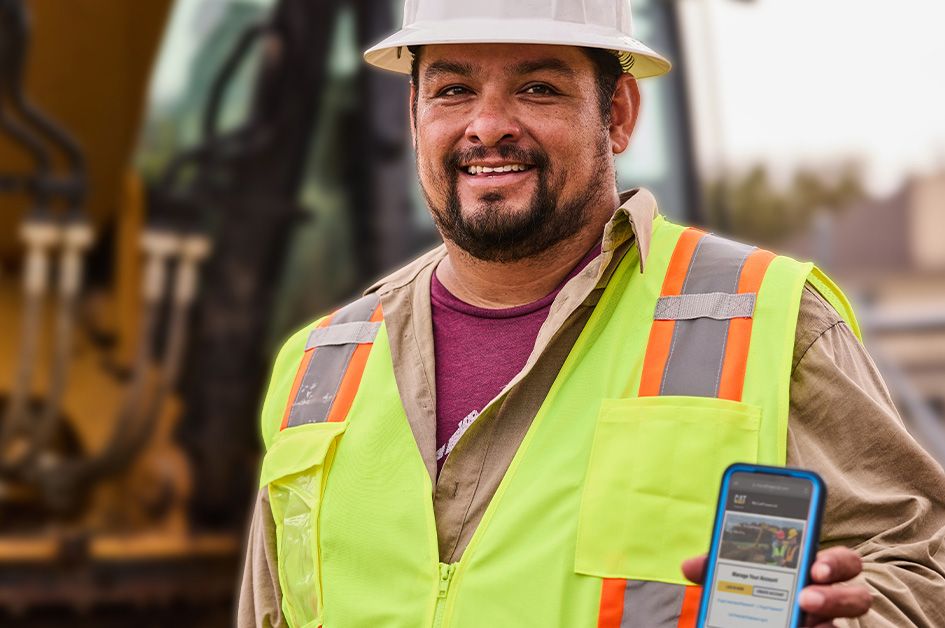 Cat employee holding cellphone displaying MyCatFinancial