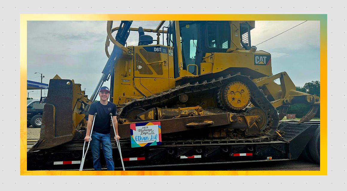 Ethan Lif in a Cat D6T wearing a Cat hat