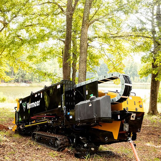 Vermeer D24 Horizontal Directional Drill setup in a wooded area