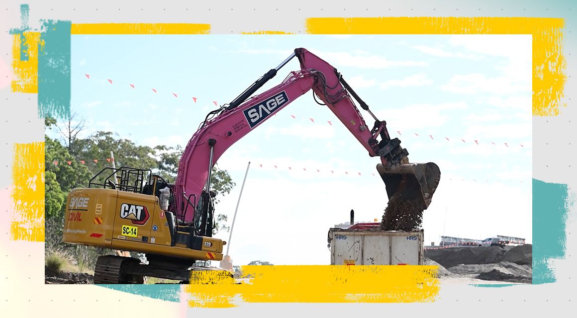Cat excavator with a pink arm