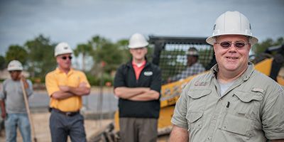 Group of Cat employees posing for camera