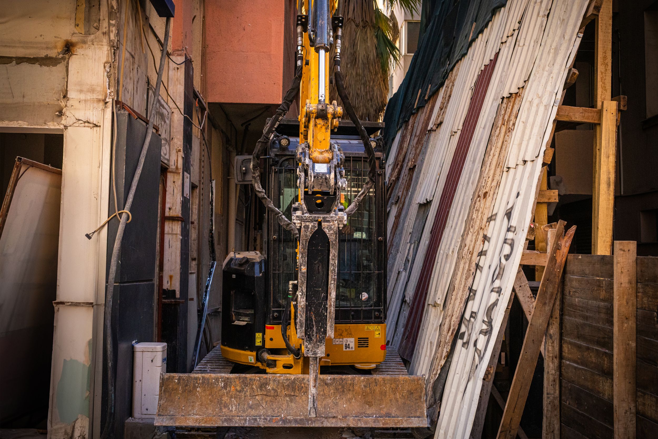 Mini excavator demolition on small structure