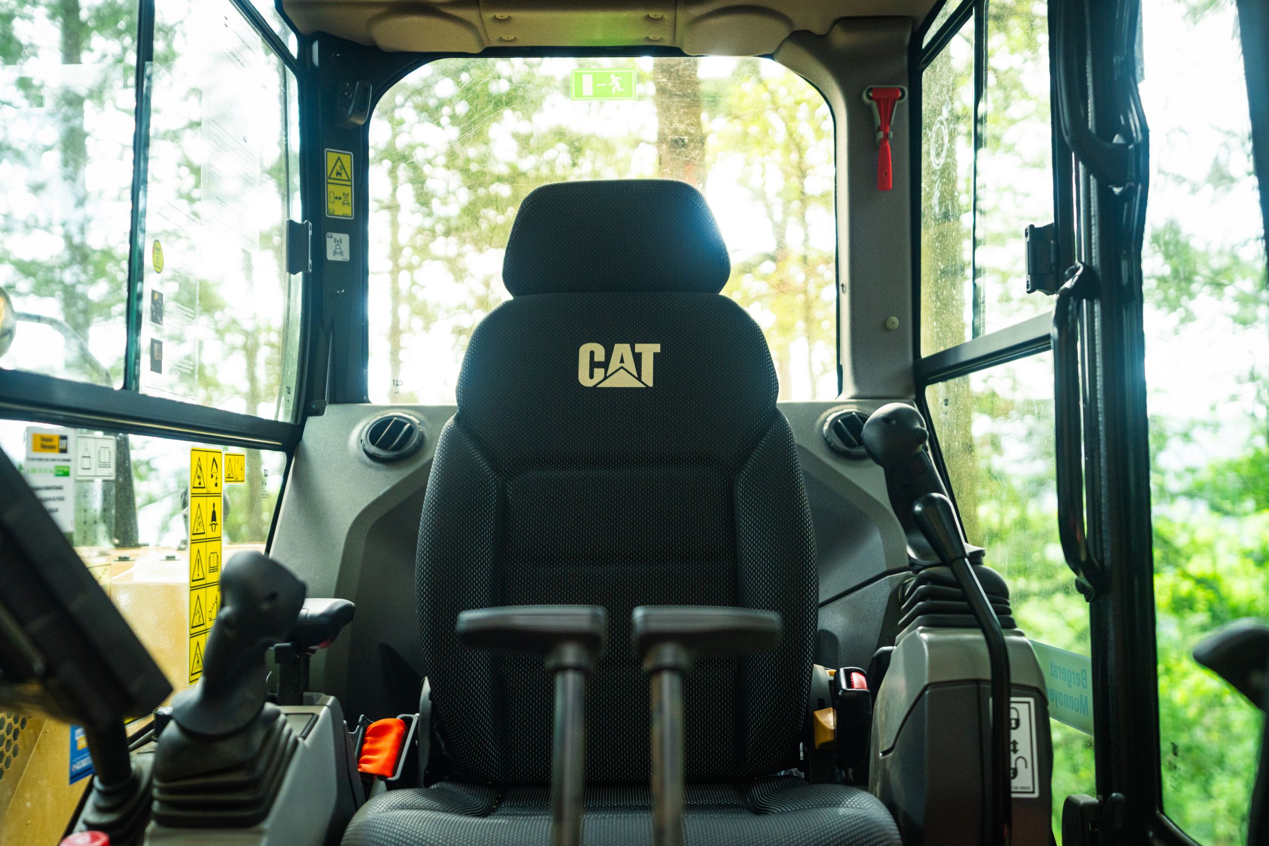 Mini excavator working on a sidewalk