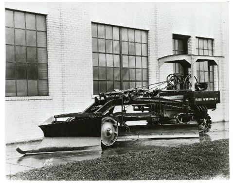 A Russell Grader No. 4 Motor Patrol with a Caterpillar track-type tractor, 1927.