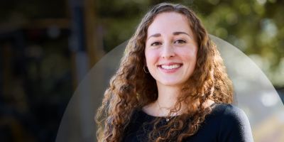 Cat financial team member smiling at camera