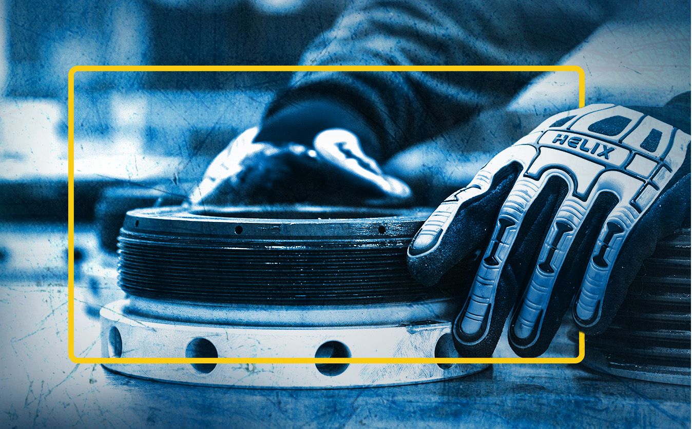 SPM employees hands turning gear