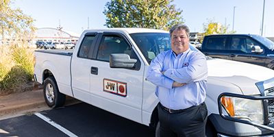 J-W Power employee smiling at camera