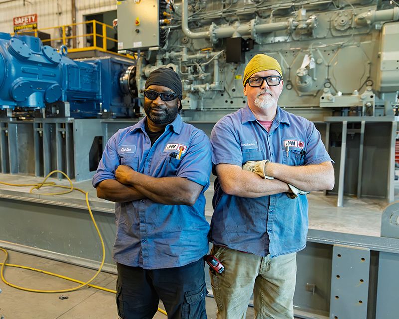 J-W Holt employees smiling at camera