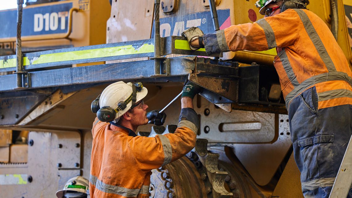 Two people Working on a Cat Rebuild