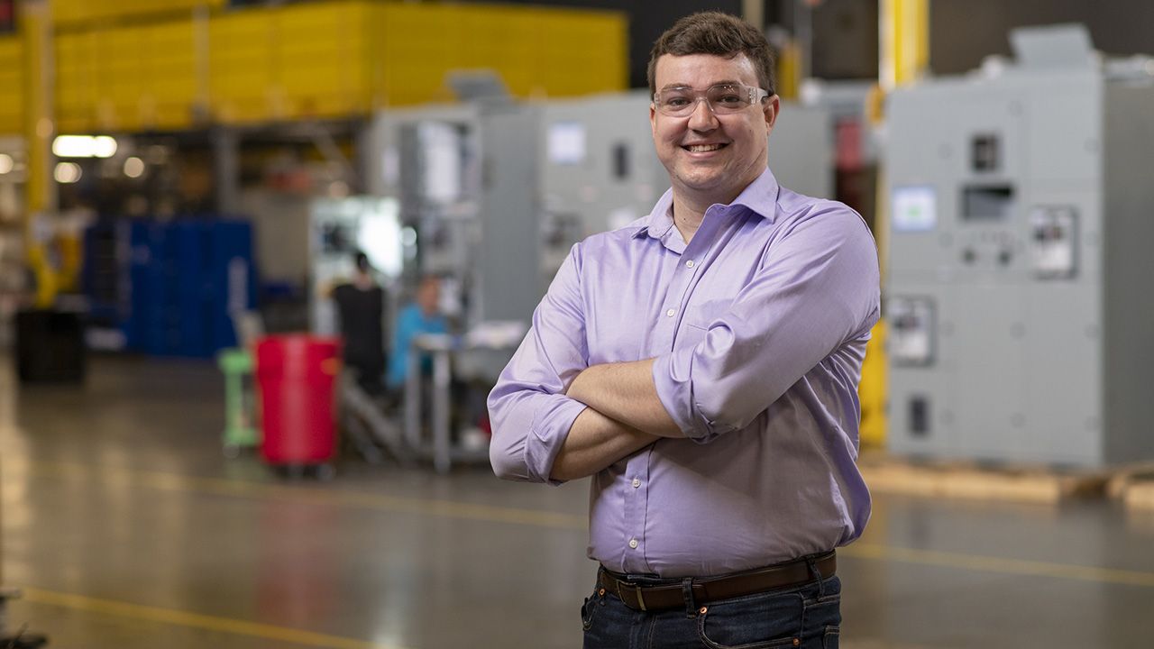 Cat employee smiling at camera