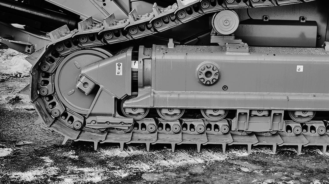 black and white closeup of Caterpillar undercarriage