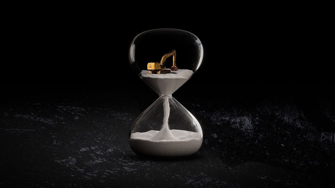 Excavator in an hourglass on a black backround