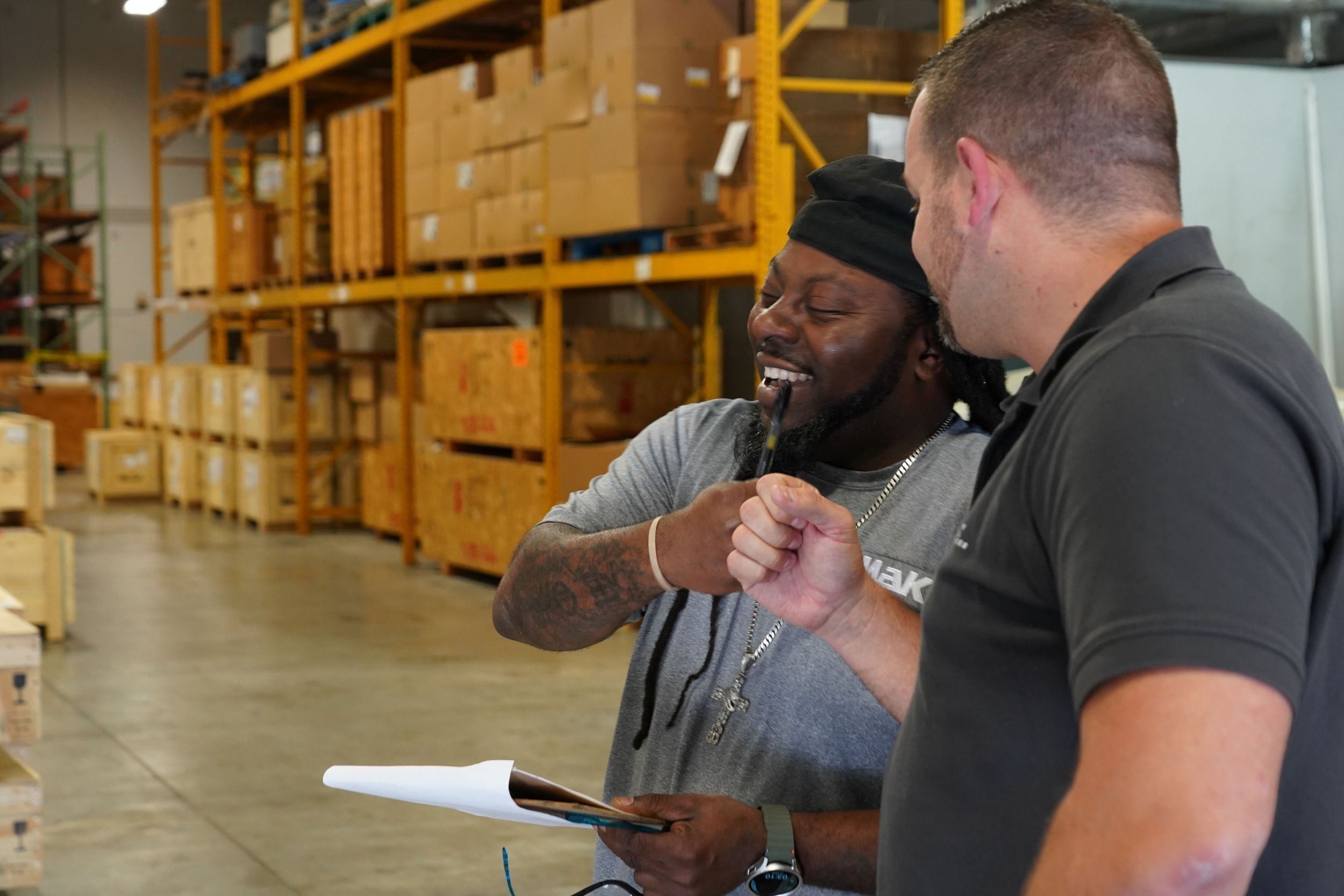 Image of two employees in a warehouse