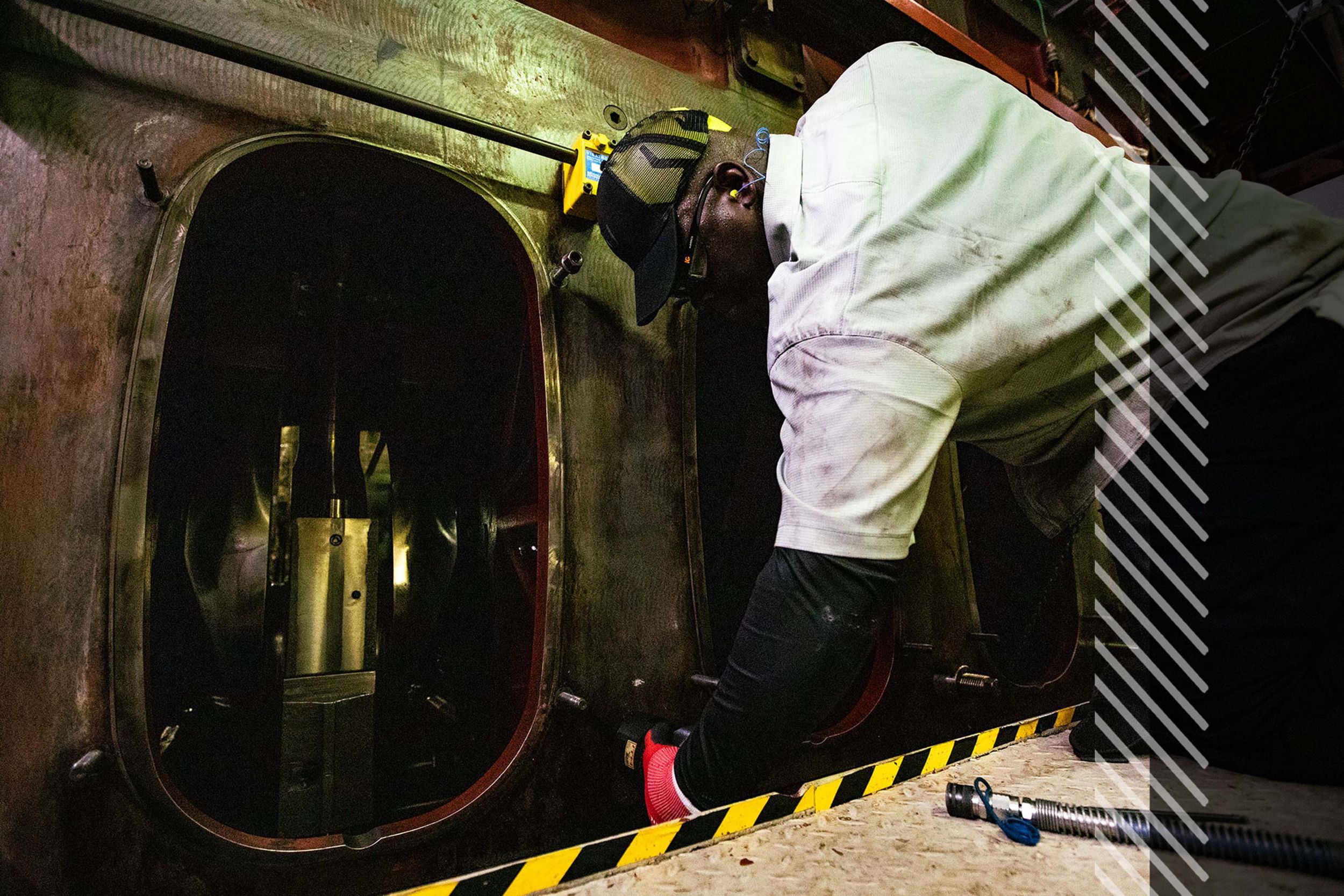 MaK employee working on engine