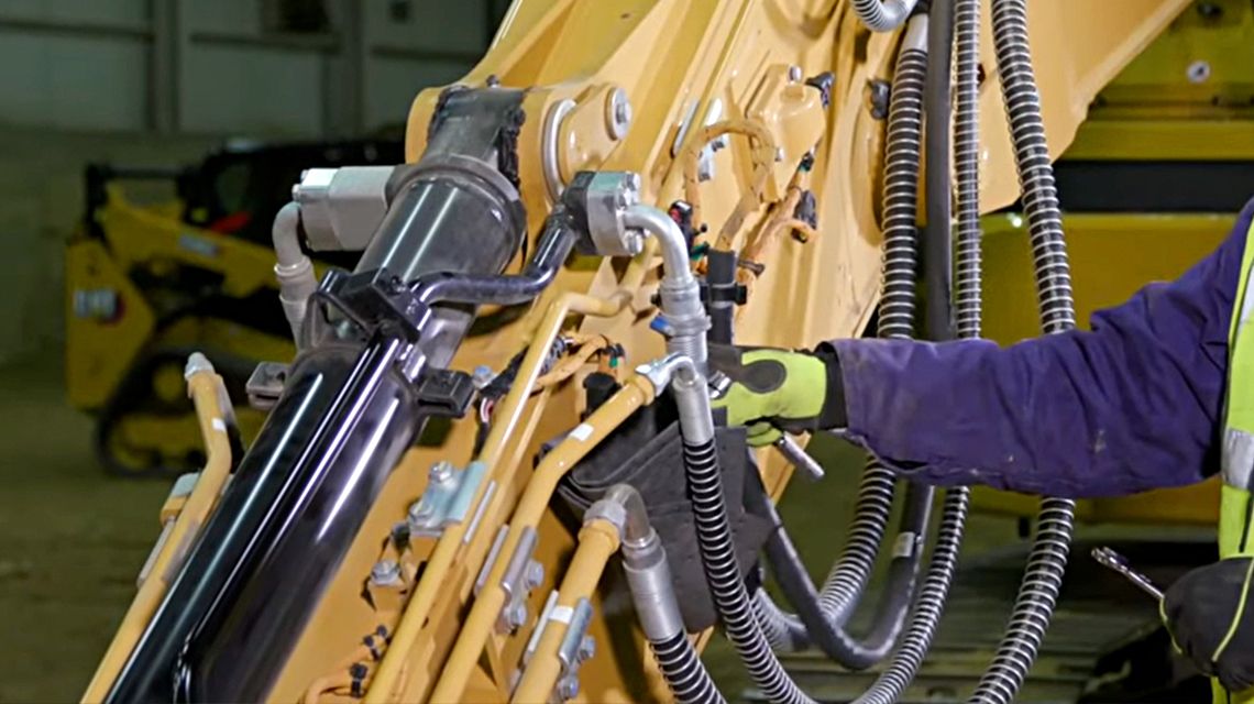 technician inspecting a machine