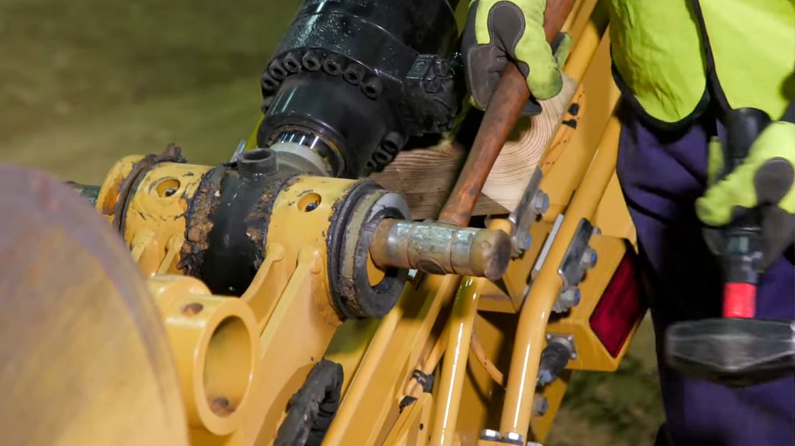 technician inspecting a machine