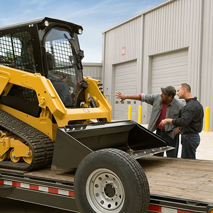 Cat dealers showing equipment to customer