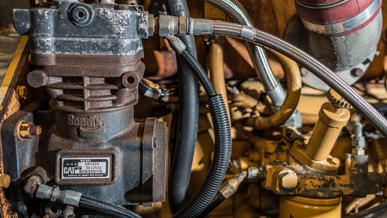 a closeup of an engine with tubes extending to the right