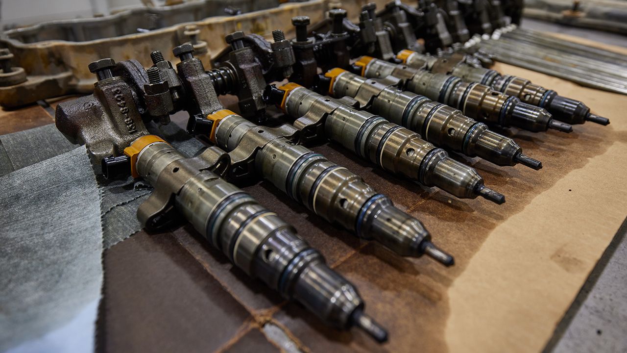 a lineup of injectors on a table