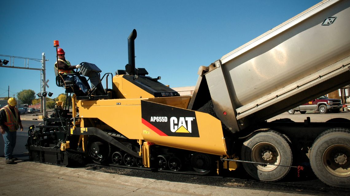 Paving machine working on a road