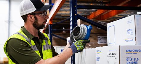 SPM employee looking at a SPM product