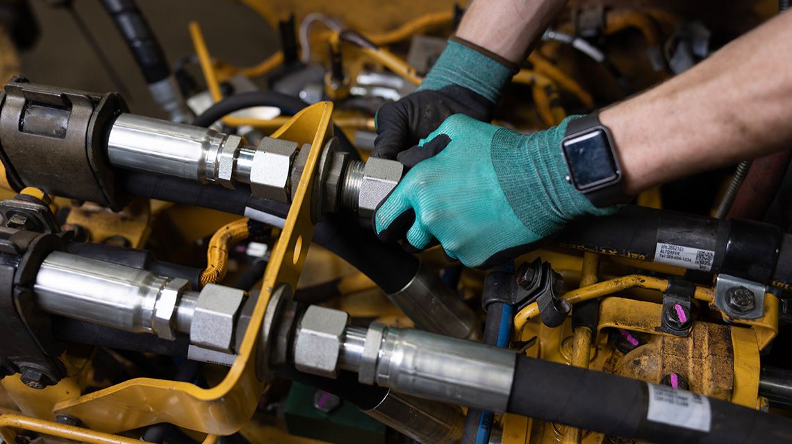 technician installing a new hose