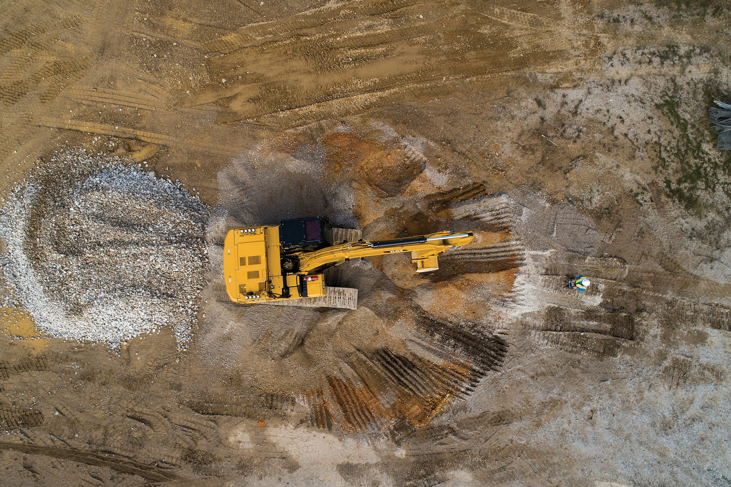 Cat excavator being operated remotely