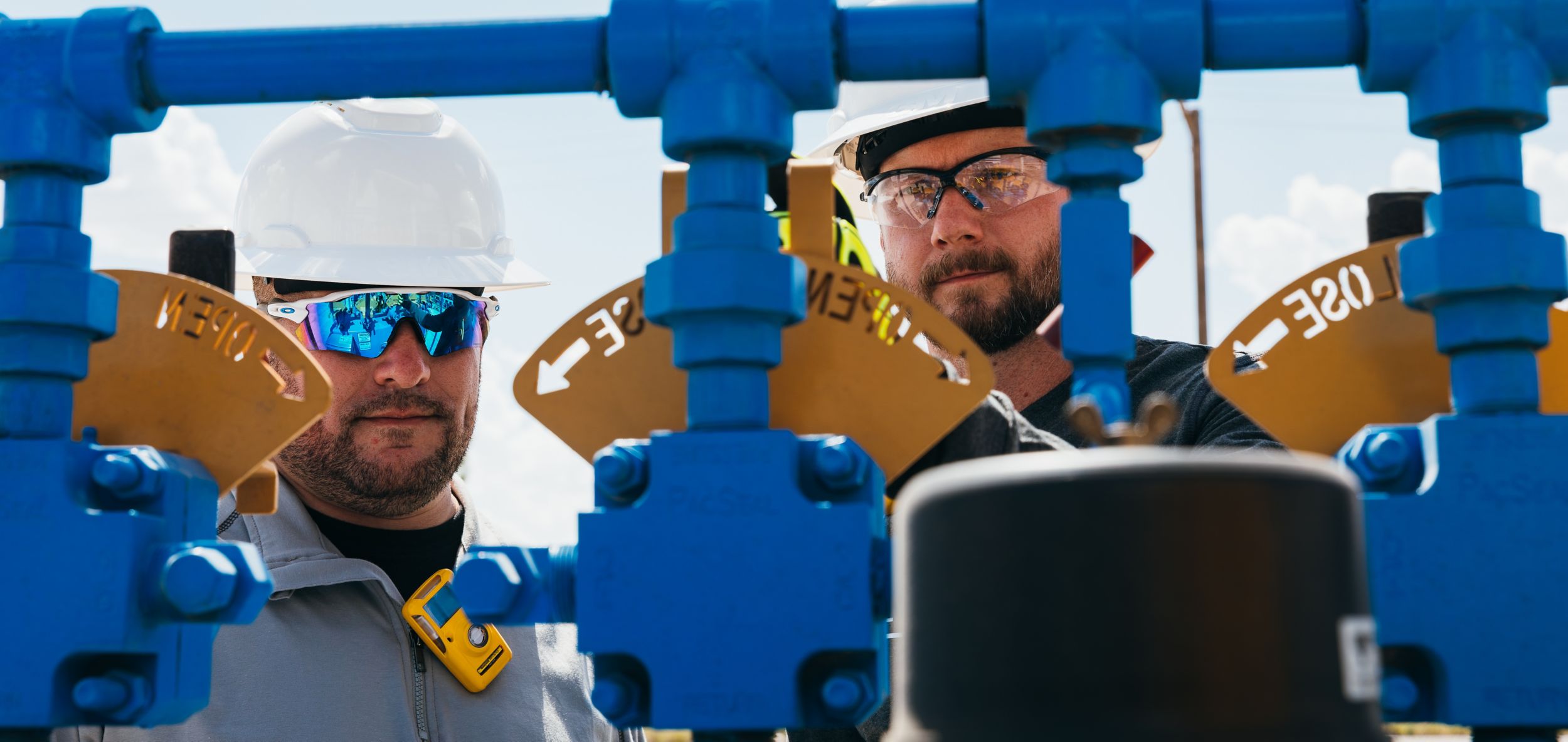Technicians inspecting flow iron