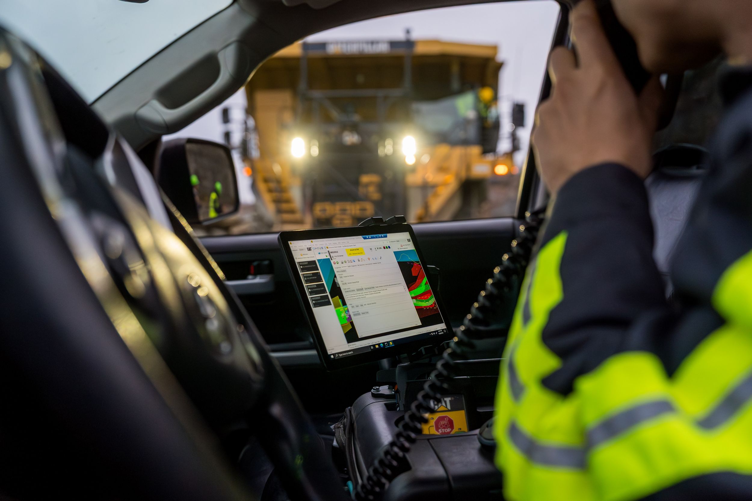 Autonomous truck viewed through the window of a light vehicle