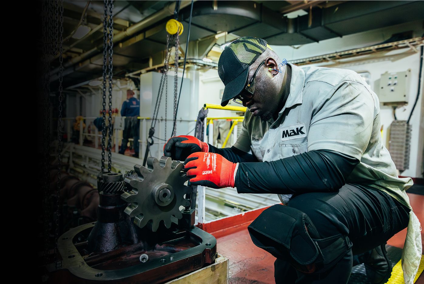 MaK employee working on engine