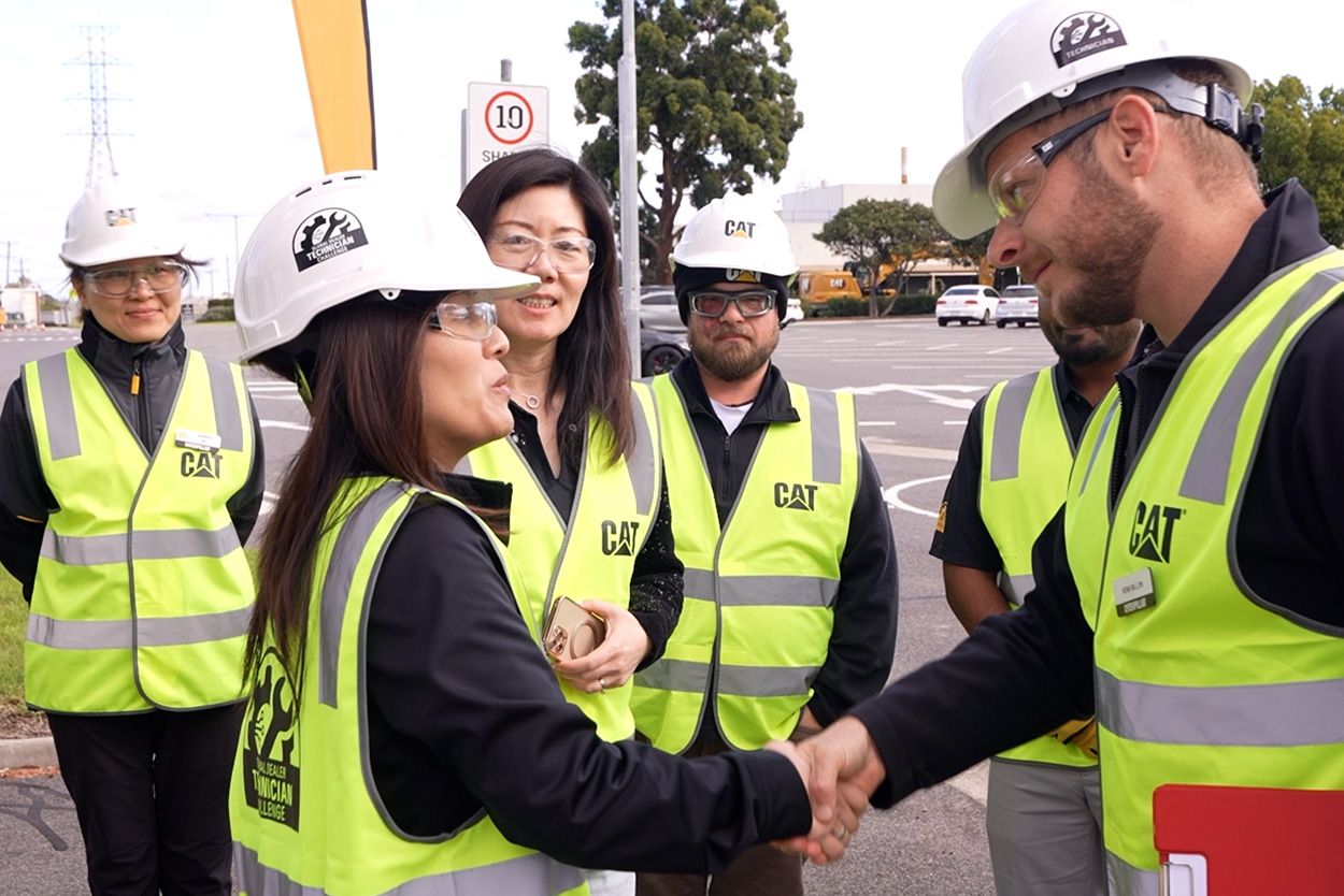 Remi and April shake hands