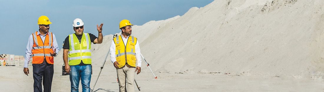 people walking with safety gear on