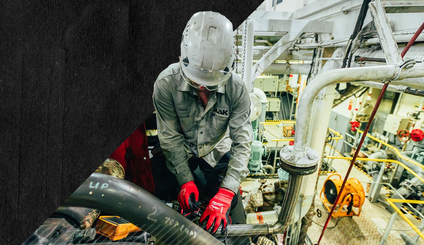 Employee working on a MaK engine