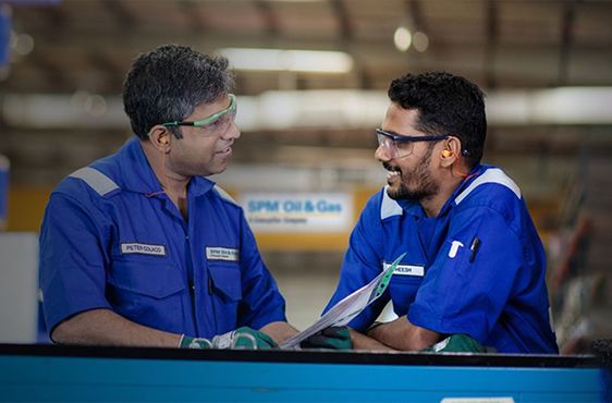 Two men talking on site 