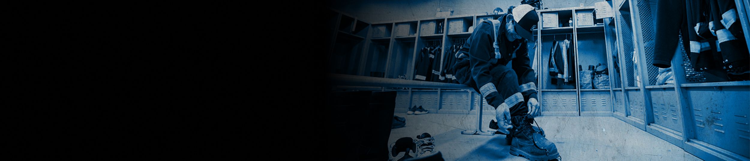 SPM employee putting on his boot preparing for work in the plant