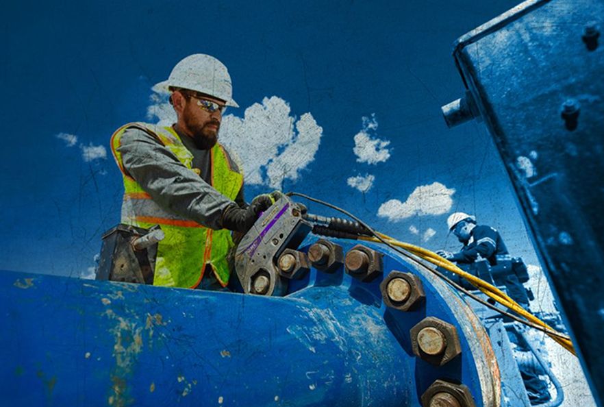 SPM employee holding a SPM part