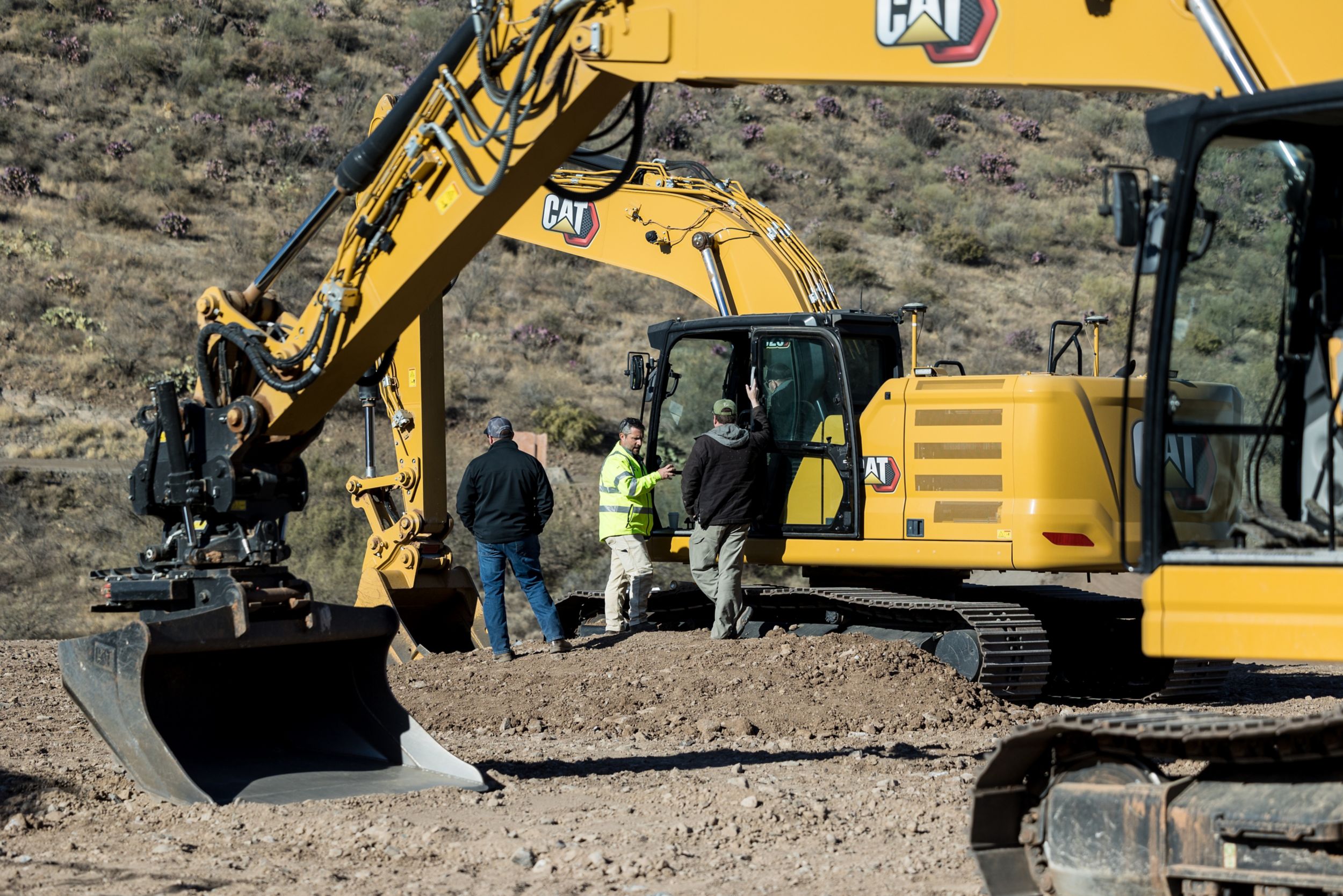 men on excavator
