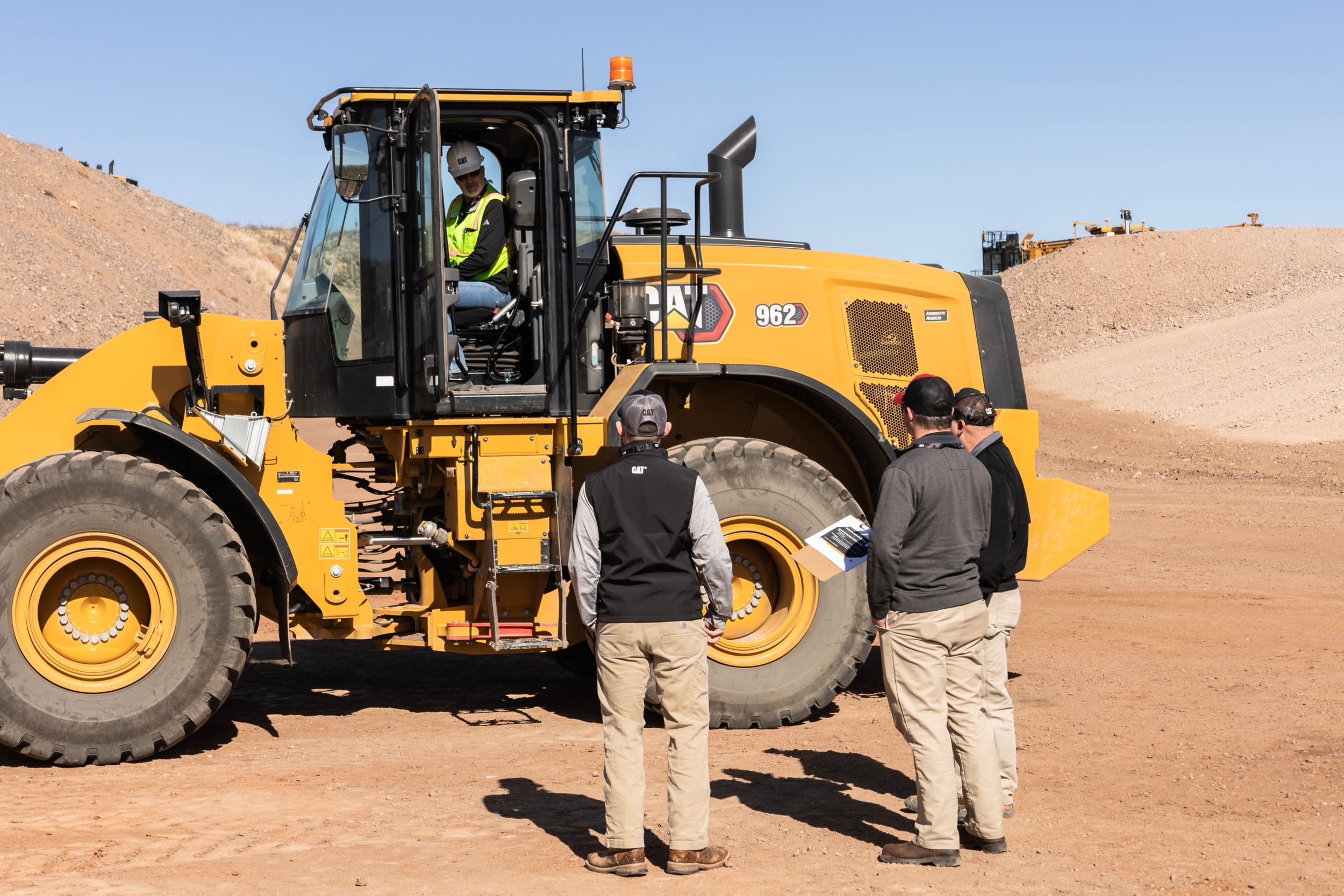 two men looking at machine