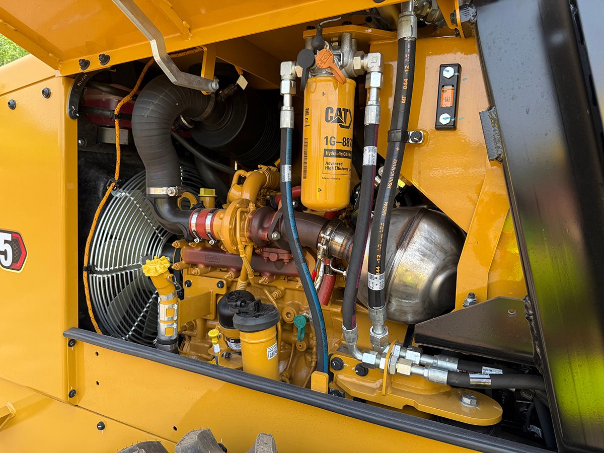 Open service door on the Cat CP5 vibratory soil compactor