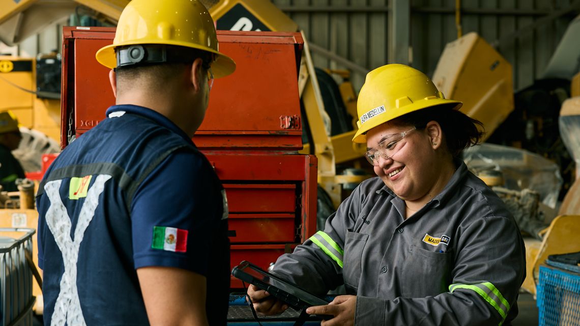 2 technicians looking at a tablet