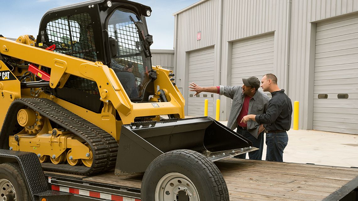 2 people discussing a machine