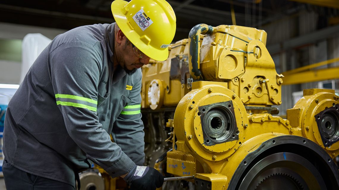 a technician working on an engine