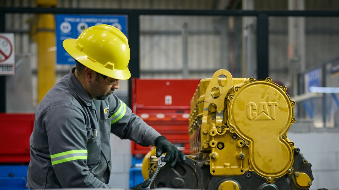 a technician performing an engine rebuild