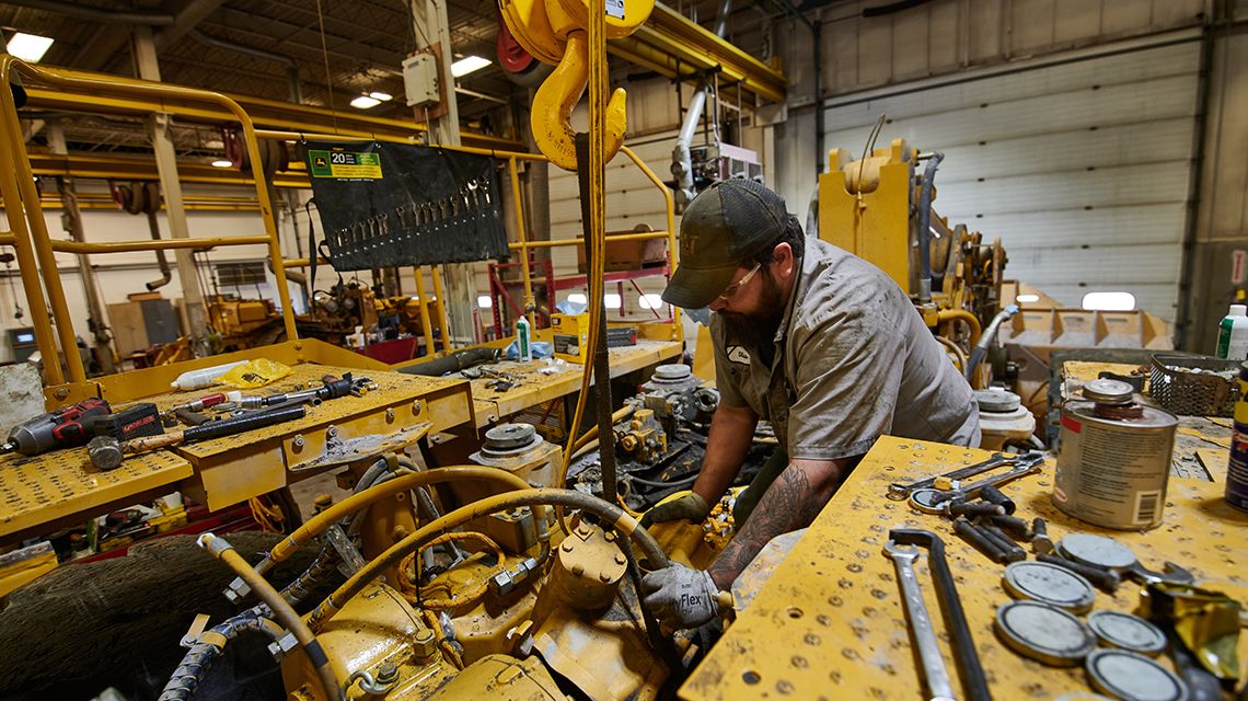 a technician working on an engine