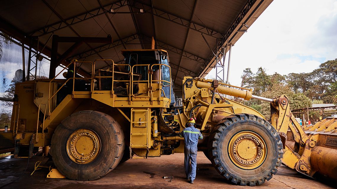 an operator inspeacing a machine