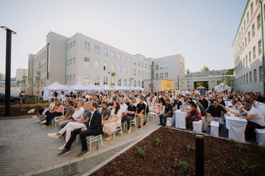 Large group of people sitting outside