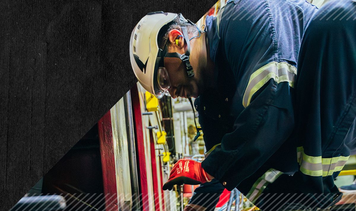 Employee working on an engine