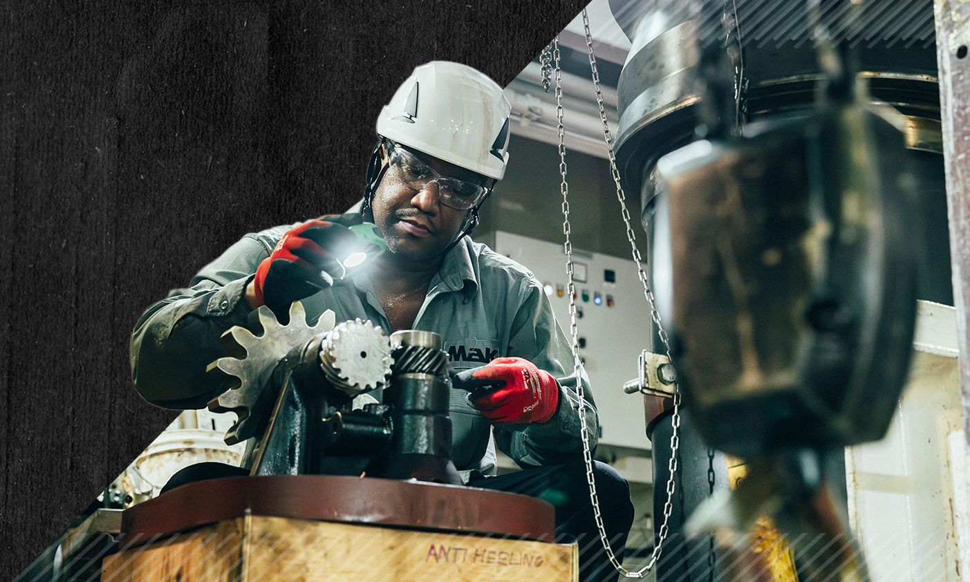 MaK employee working on a part