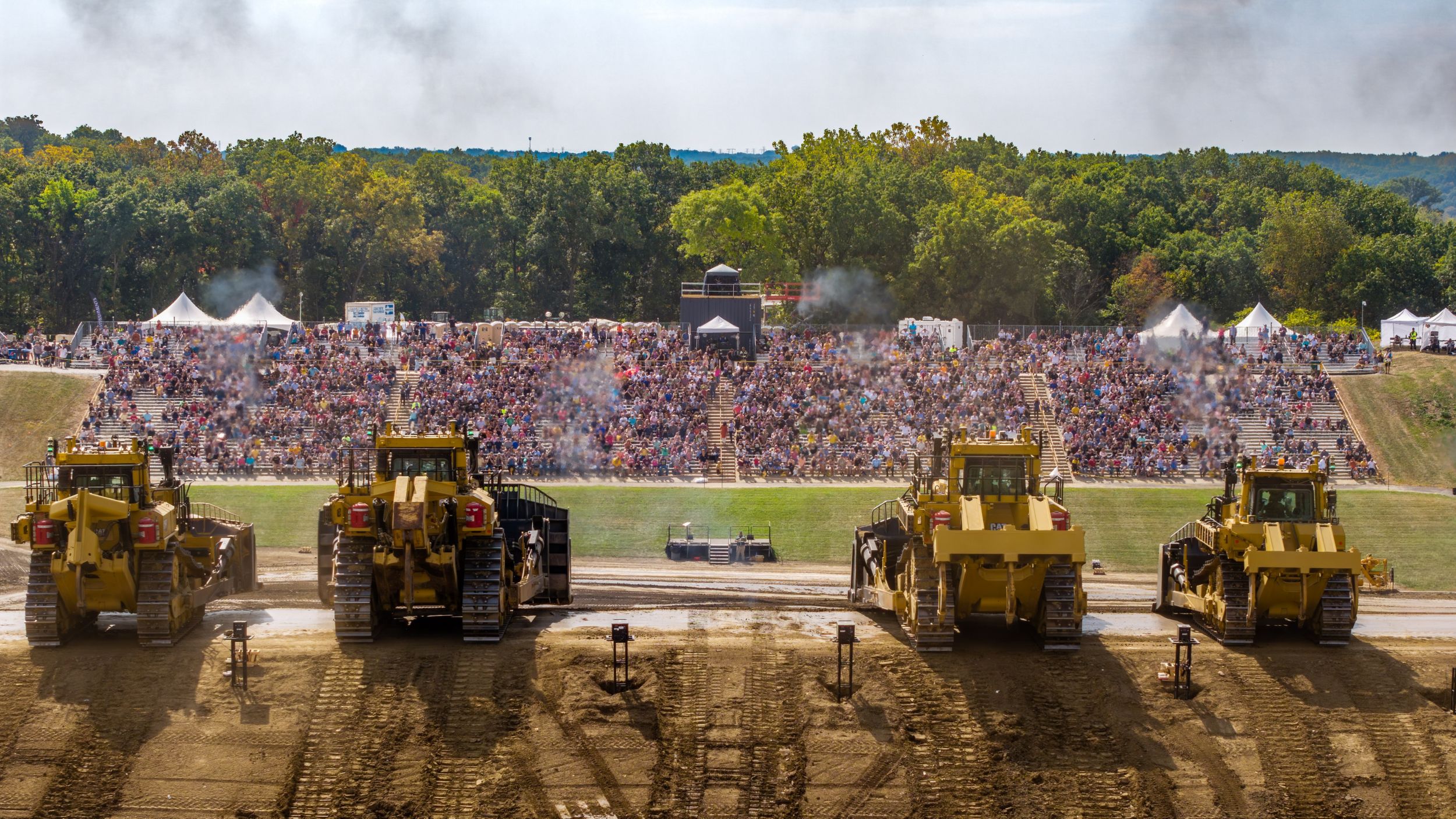 Cat machines in an arena in front of an audience