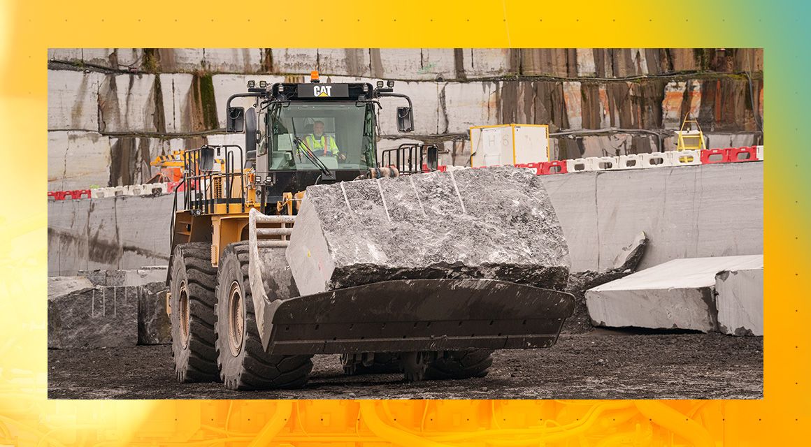 Cat Wheel Loader lifting concrete on a jobsite